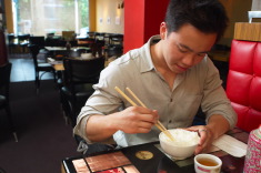 man eating rice